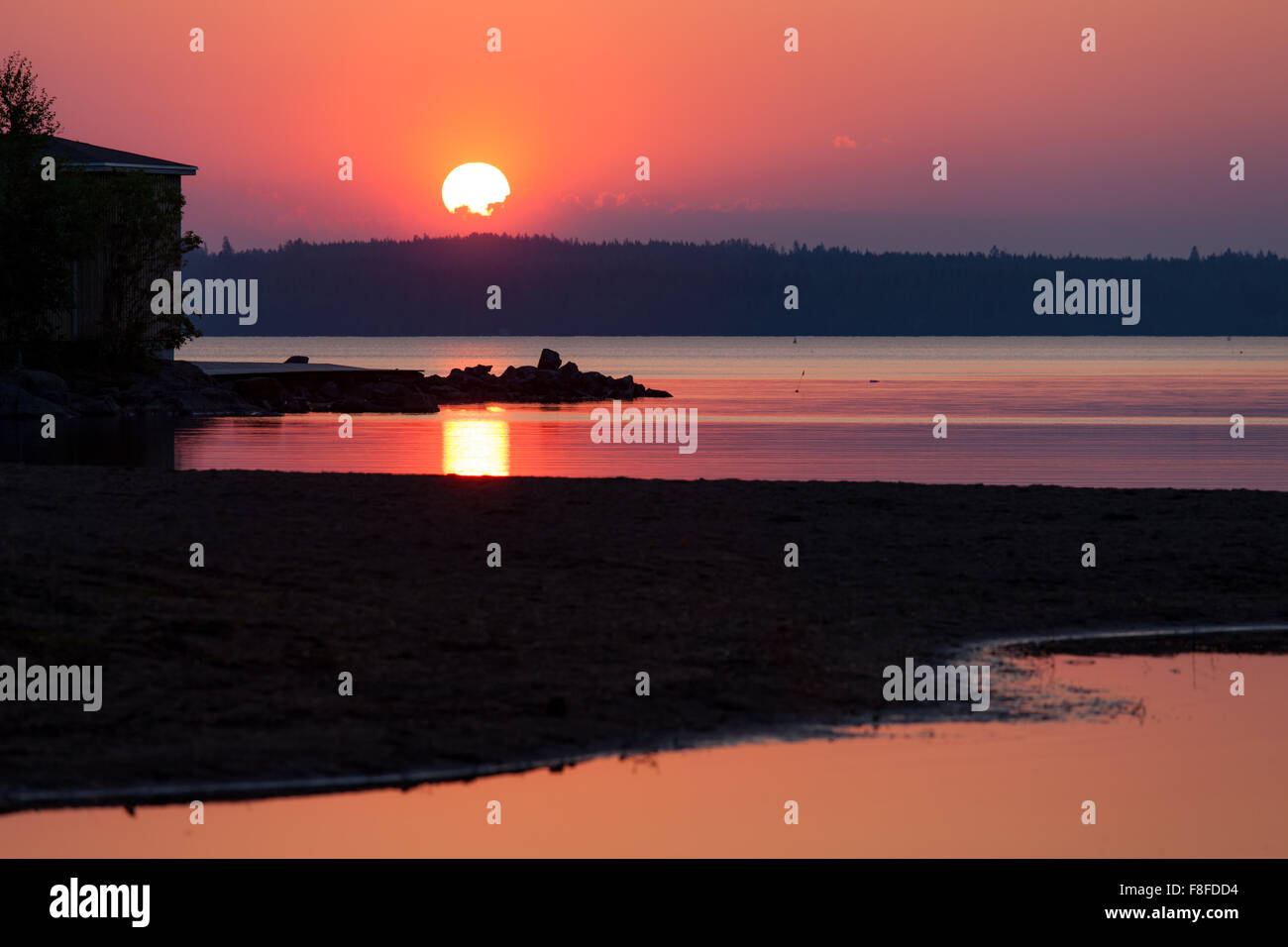 Lebendige Silhouette und Sonnenuntergang Strand Stockfoto