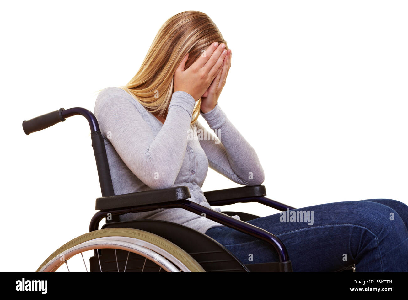 Junge traurig behinderte Frau im Rollstuhl zu weinen Stockfoto