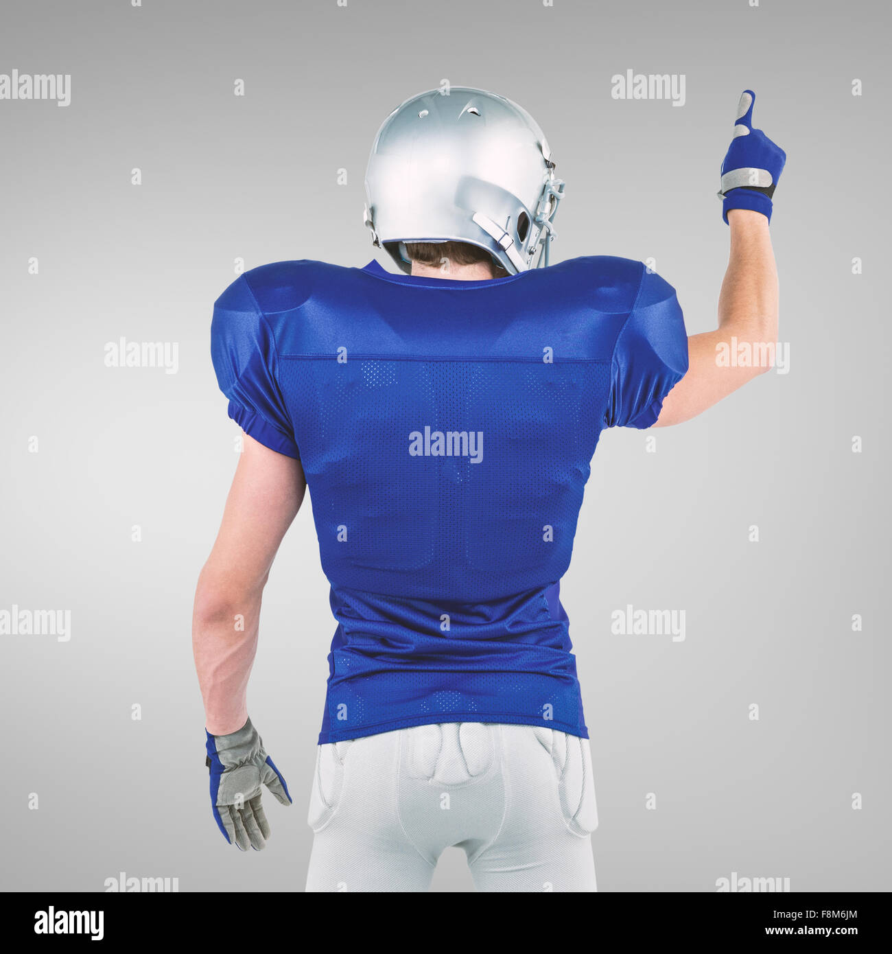 Zusammengesetztes Bild der Heckansicht des american Footballspieler zeigen Stockfoto