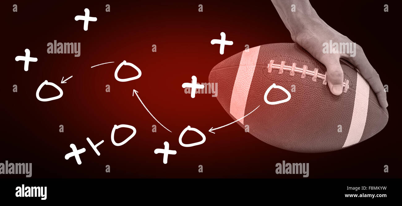 Zusammengesetztes Bild Nahaufnahme von american Football-Spieler den Ball platzieren Stockfoto