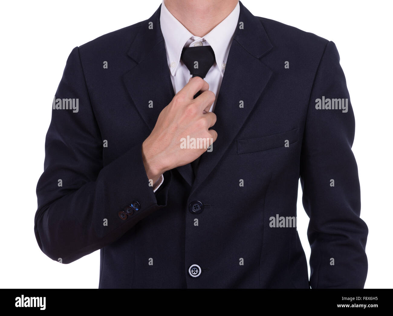 Geschäftsmann im Anzug, die Krawatte isoliert auf weißem Hintergrund zu binden Stockfoto