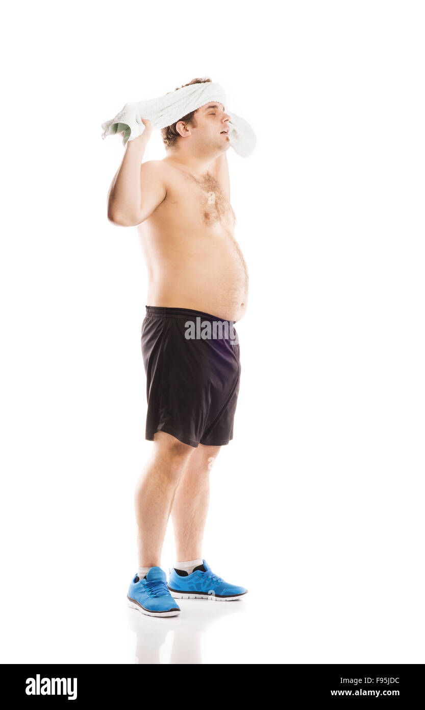 Fett Fitness Mann posiert im Studio auf weißem Hintergrund. Stockfoto