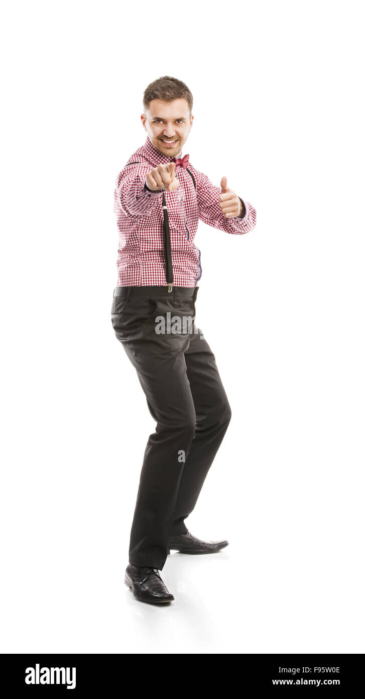 Funny Business Mann posiert im Studio mit Fliege und Hosenträger Stockfoto