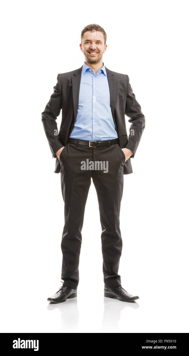 Erfolgreicher Geschäftsmann im Anzug posiert im Studio isoliert auf weißem Hintergrund. Ganzkörper-Porträts. Stockfoto
