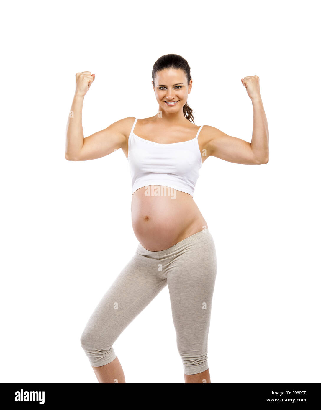 Studio-Porträt einer schönen jungen schwangeren Übungen, isoliert auf weißem Hintergrund Stockfoto