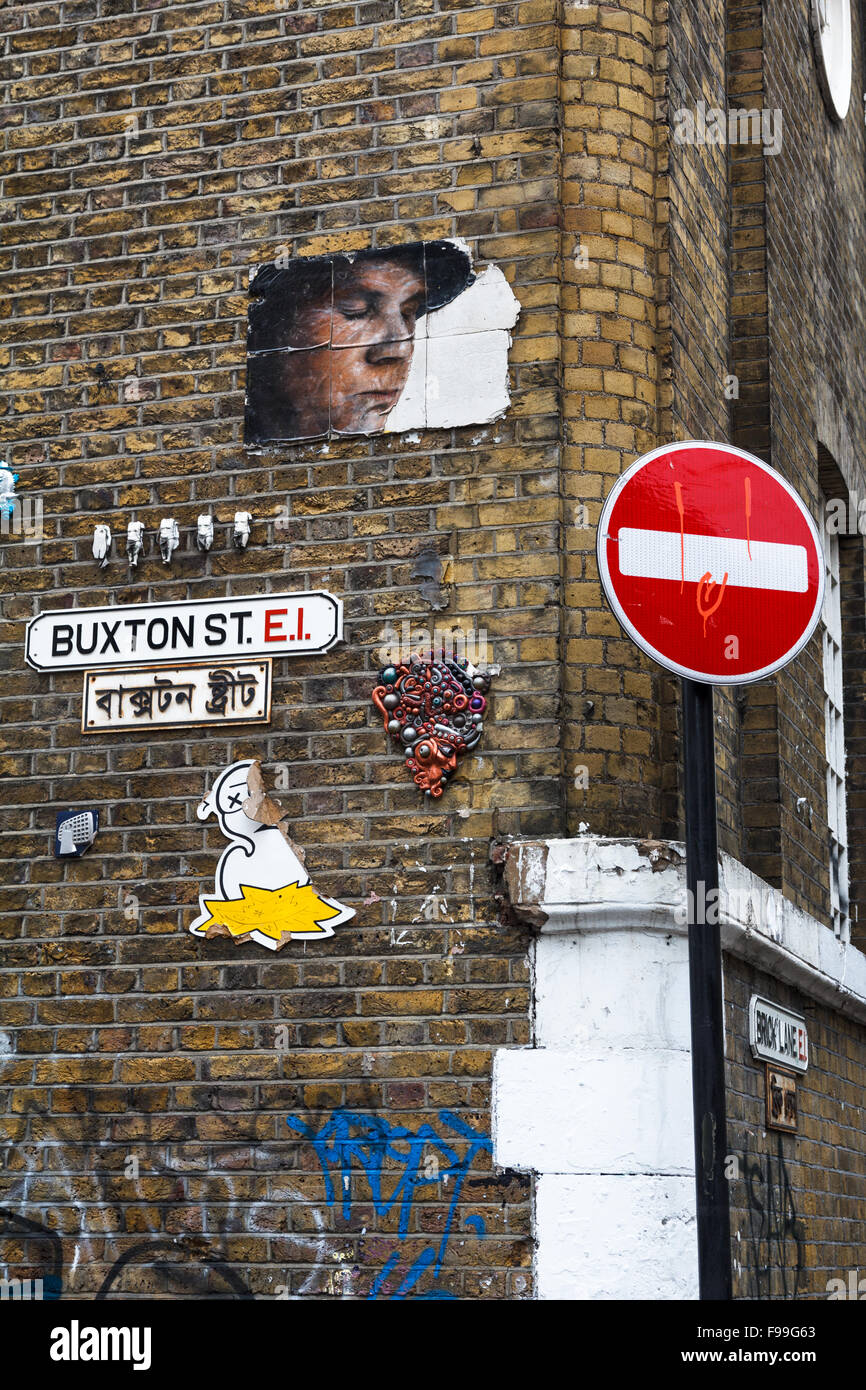Street-Art auf eine Mauer in Buxton Straße, Shoreditch, im Borough of Tower Hamlets Stockfoto