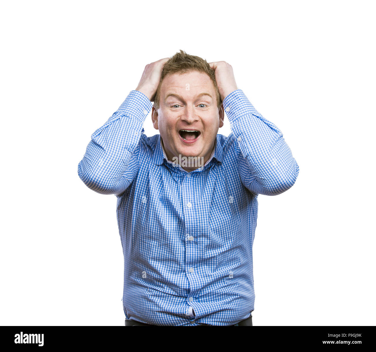 Glücklich, junger Mann im blauen Hemd zu posieren. Studio auf weißem Hintergrund gedreht. Stockfoto