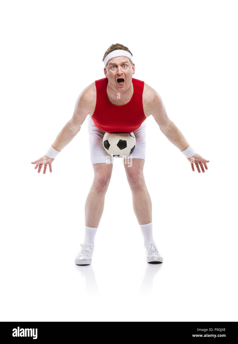 Lustige ungeschickt-Football-Spieler mit einem Ball. Studio auf weißem Hintergrund gedreht. Stockfoto