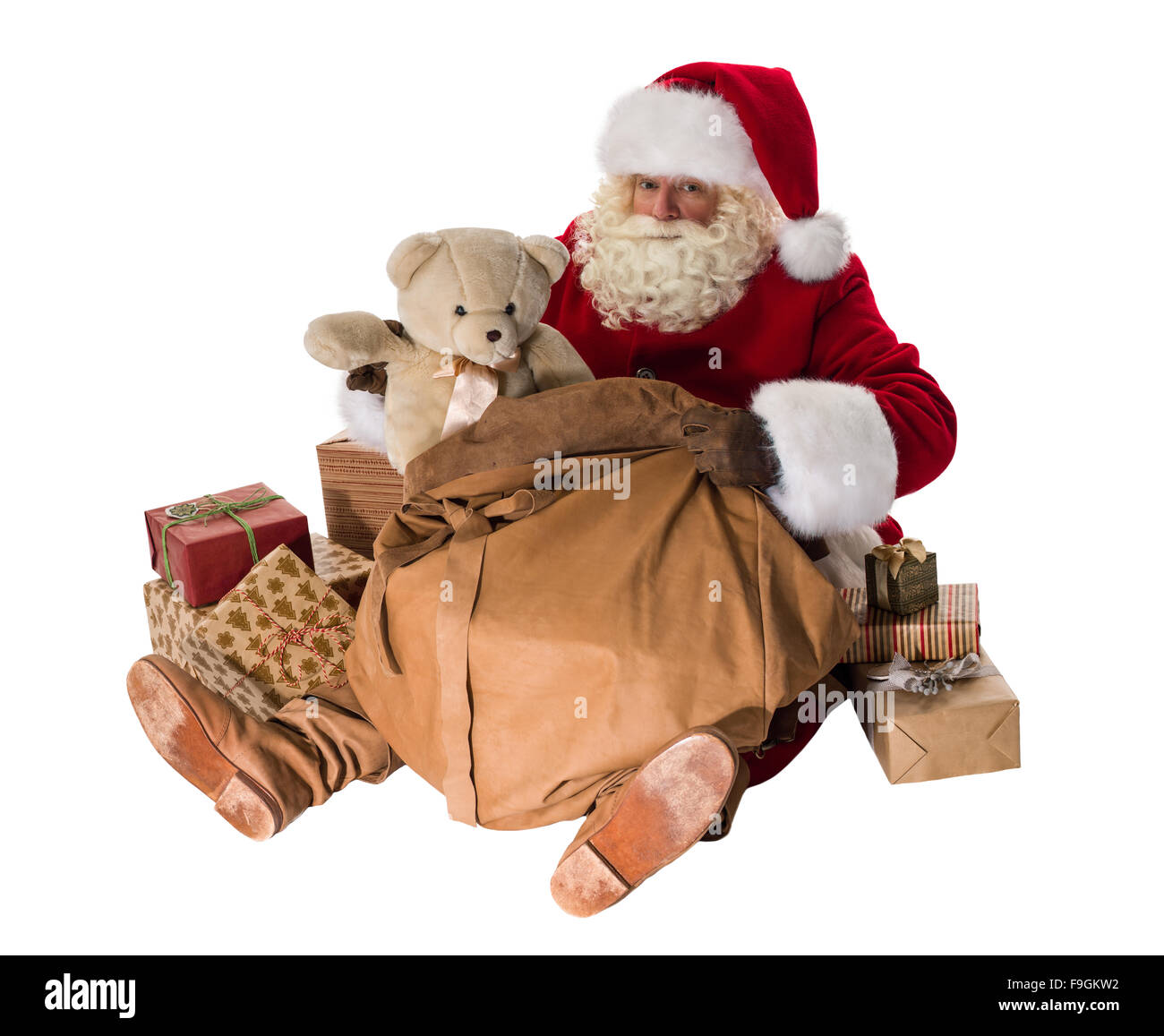 Santa Claus mit seiner großen Tasche voller Geschenke und Spielzeug voller Portrait sitzen Stockfoto