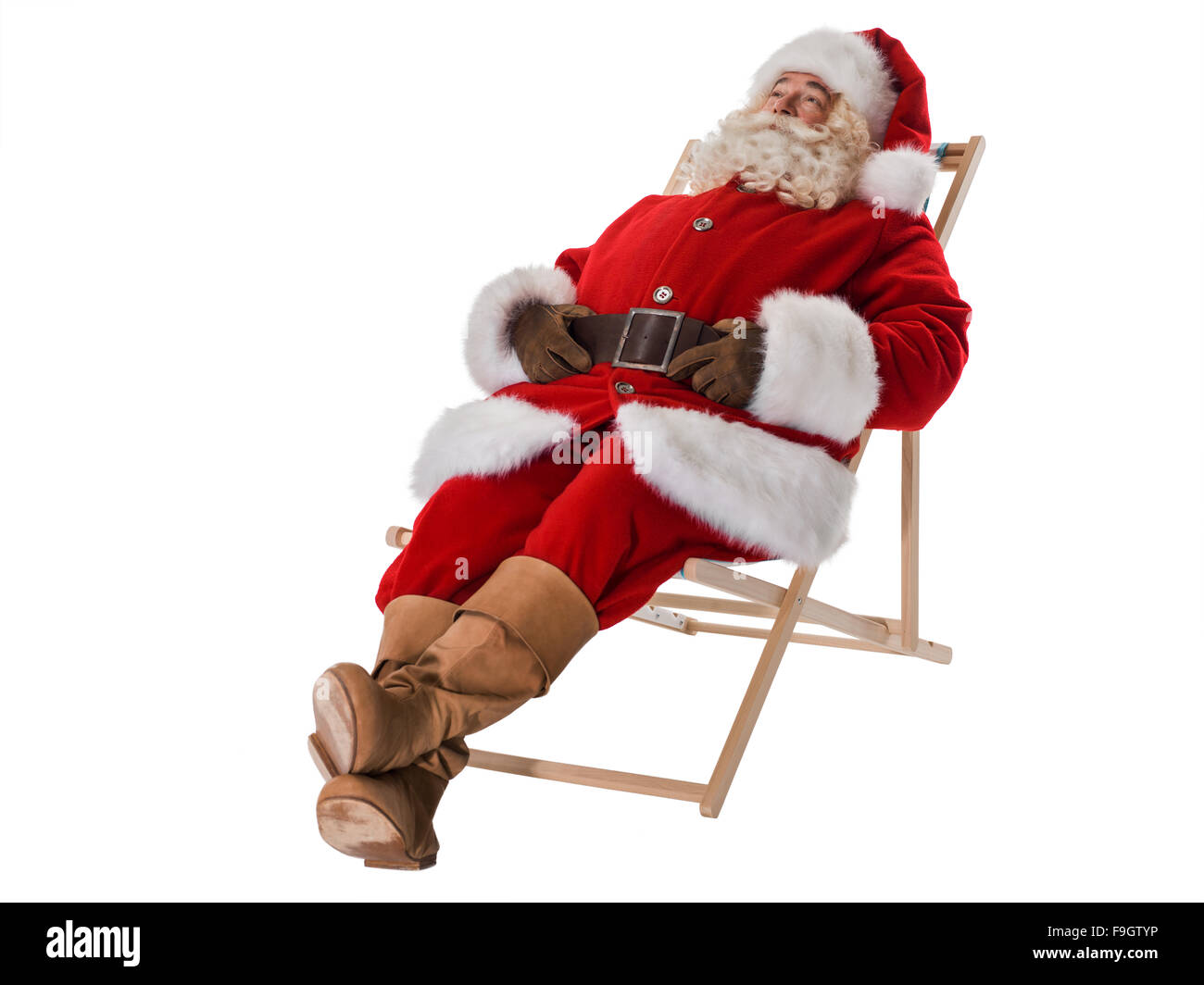 Santa Claus ruht auf Deck Stuhl voller Portrait Stockfoto