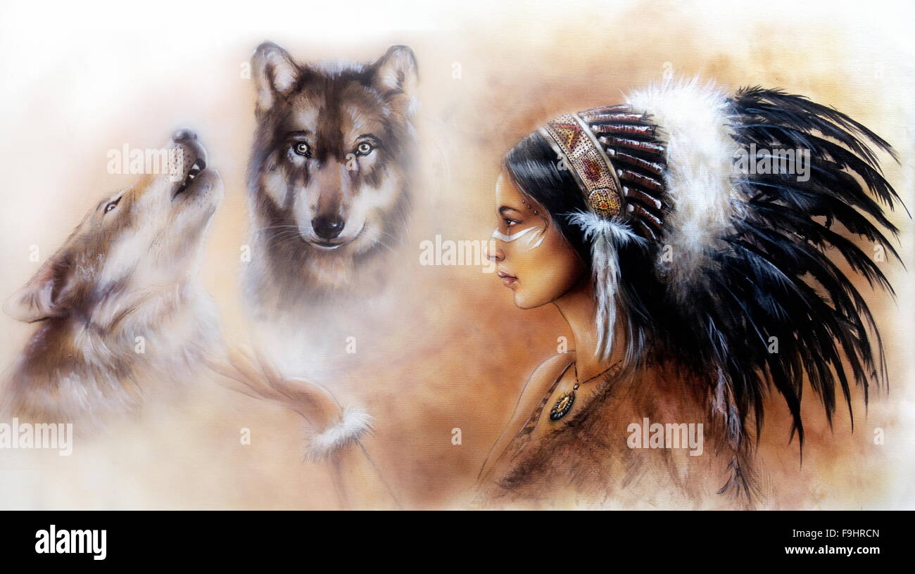 Eine schöne Airbrush-Lackierung einer jungen indischen Frau trägt einen wunderschöne Feder Kopfschmuck, mit einem Bild von zwei weißen Wölfe Geister schweben ihre Handfläche. Stockfoto