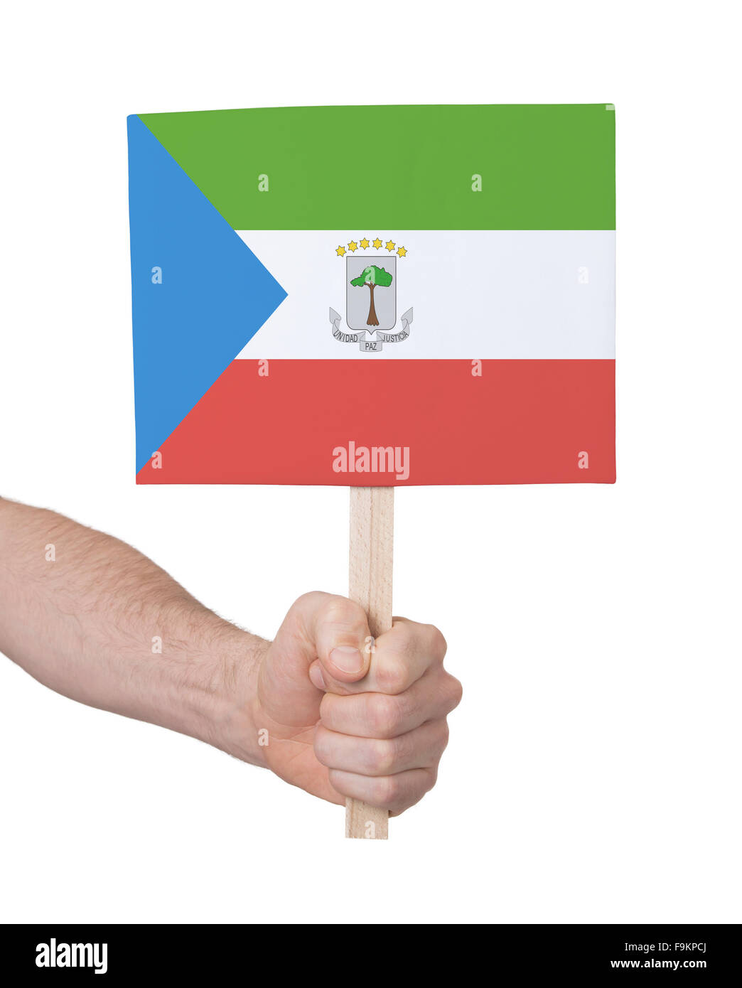 Hand, die kleine Karte, isoliert auf weiss - Flag von Äquatorial-Guinea Stockfoto