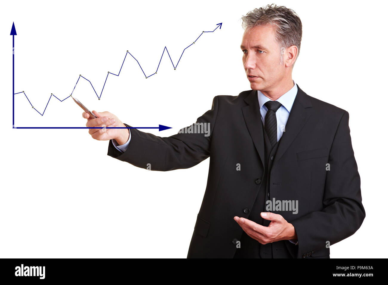 Senior Business-Mann erklärt finanzielle Trend mit einem Diagramm Stockfoto