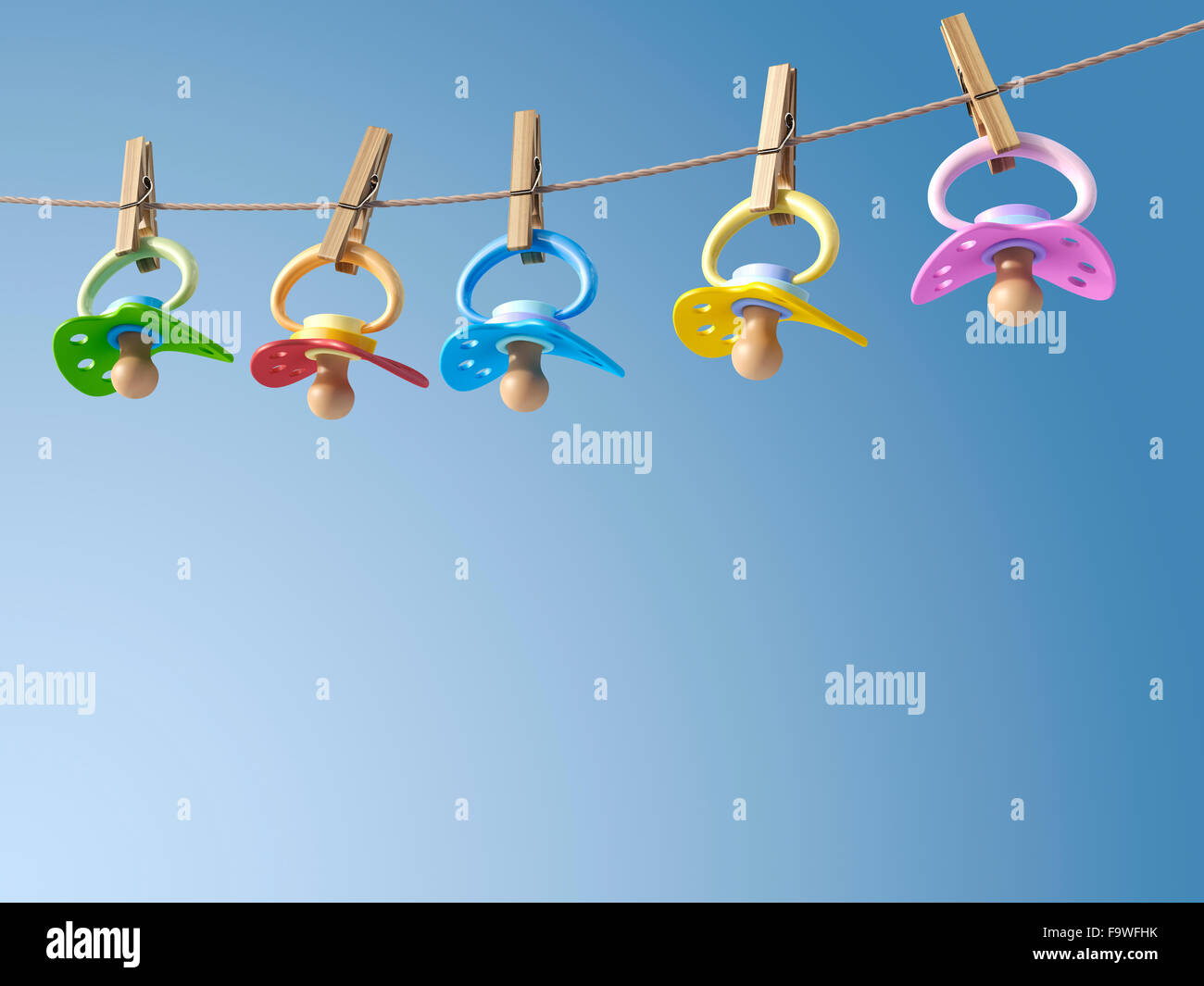 Fünf Schnuller hängen, eine Wäscheleine, 3D Rendering Stockfoto