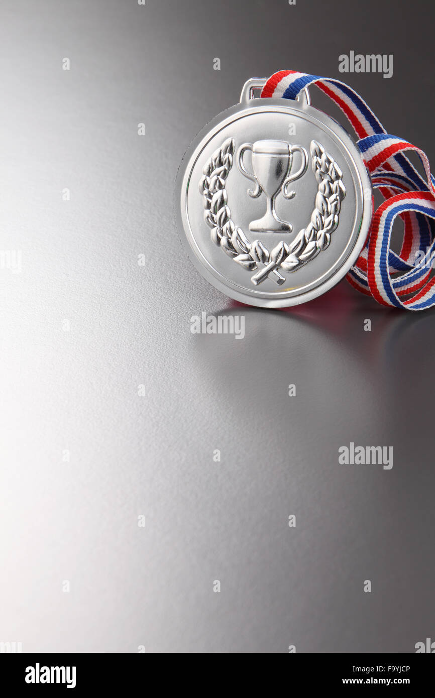 Silbermedaille auf Ggray Hintergrund Stockfoto