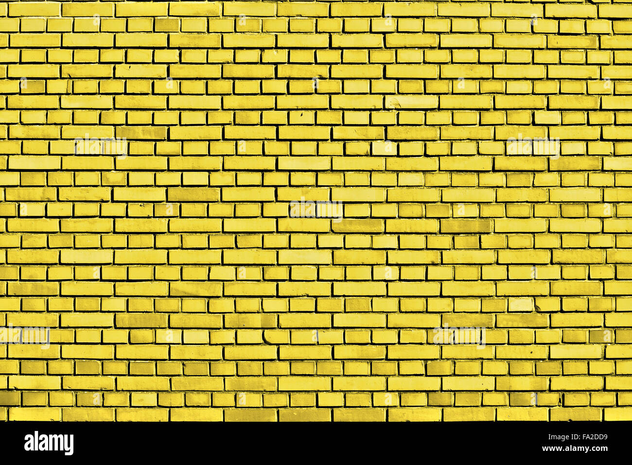 Buttercup yellow Brick Wall Hintergrund Stockfoto