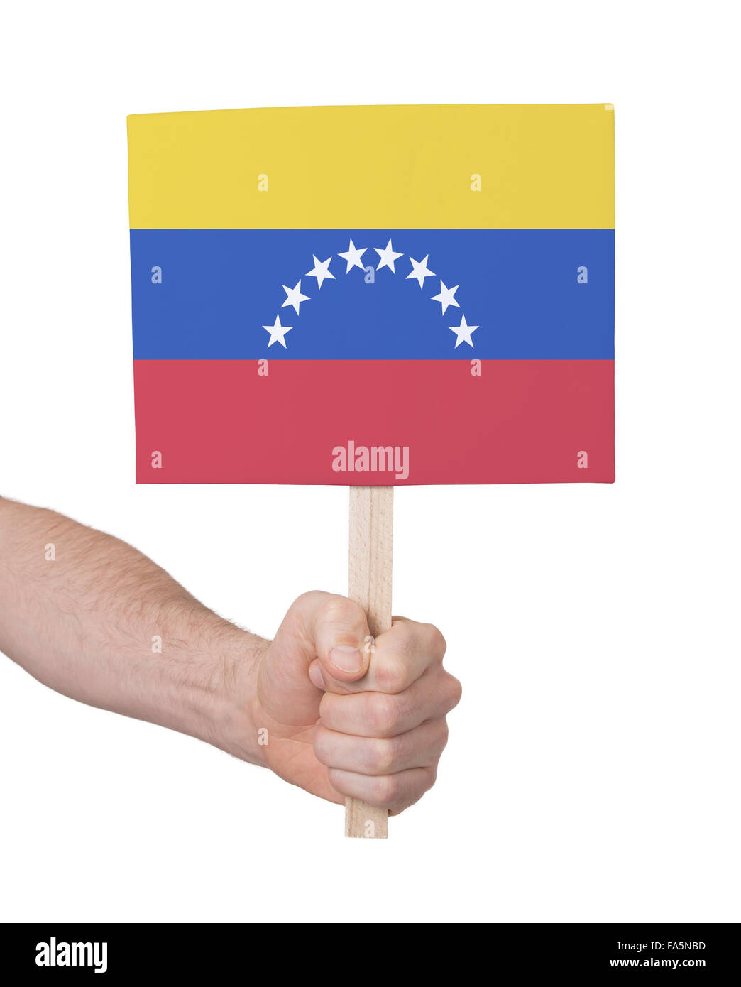 Hand, die kleine Karte, isoliert auf weiss - Flagge Venezuelas Stockfoto