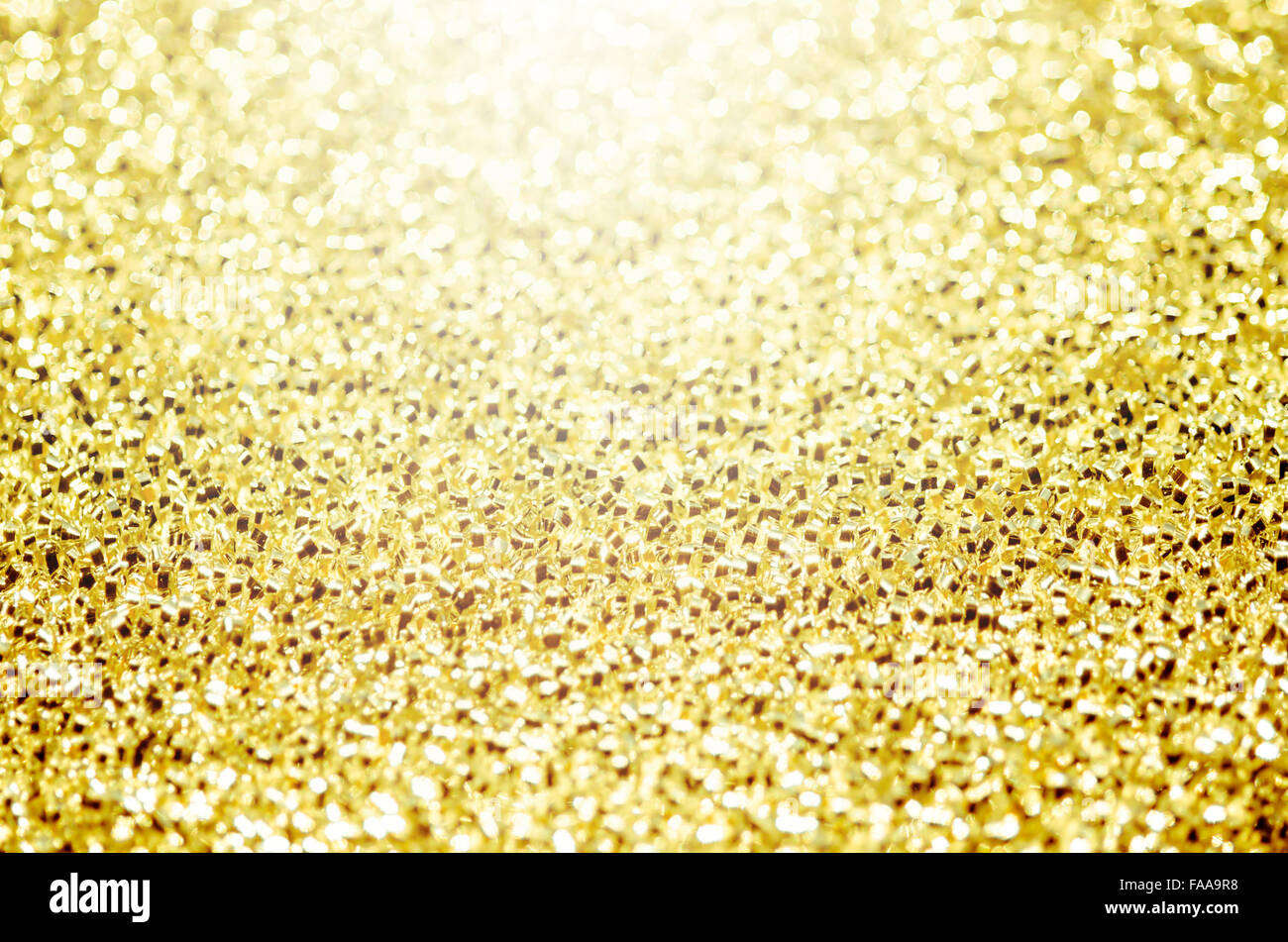 Weihnachten Golden glitzernden Hintergrund. Holiday Gold abstrakte Textur. Bokeh Stockfoto