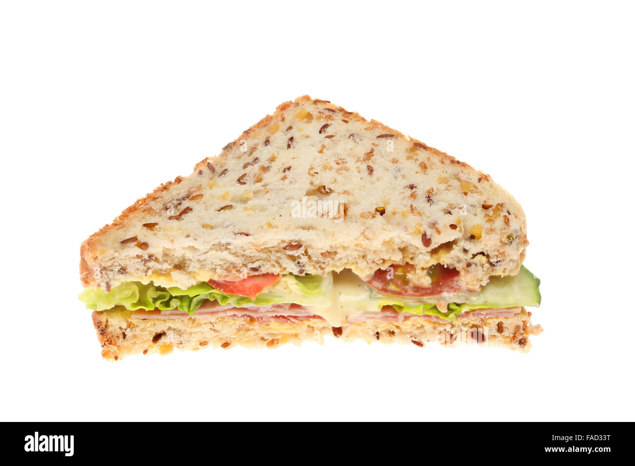 Schinken und Salat Sandwich gemacht mit Soja und Leinsamen Brot isoliert gegen weiß Stockfoto