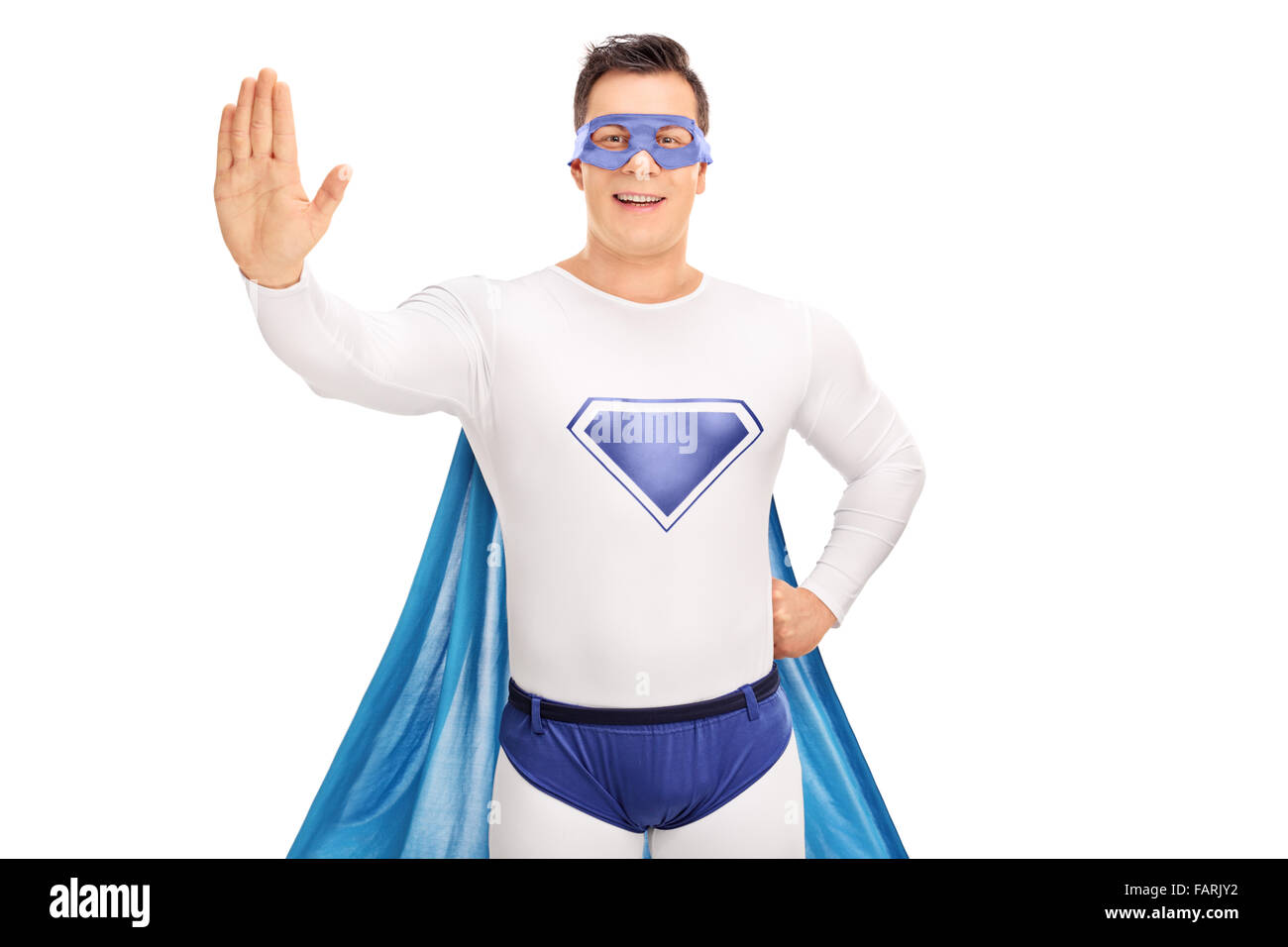 Studioaufnahme eines männlichen Superhelden einen Stopp Geste mit der Hand isoliert auf weißem Hintergrund Stockfoto