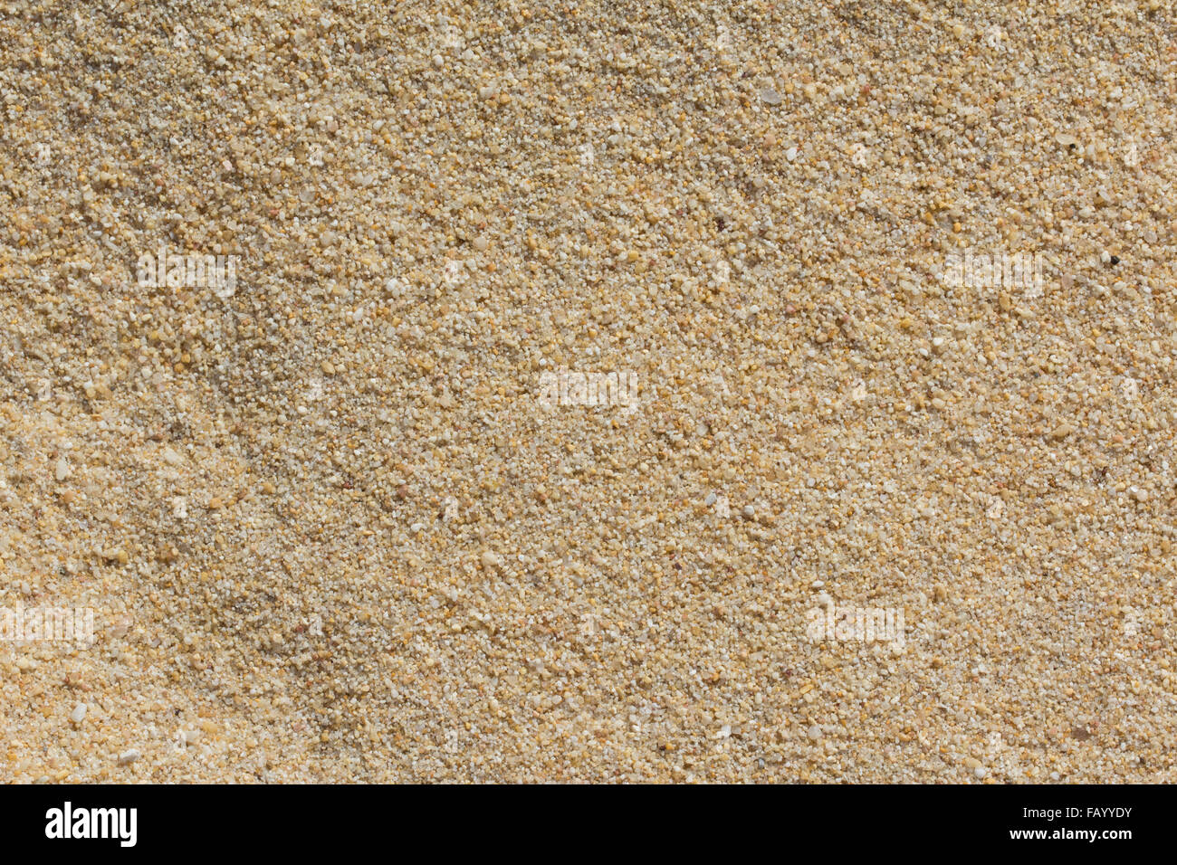 Gelber Sand Textur Hintergrund am Strand Stockfoto