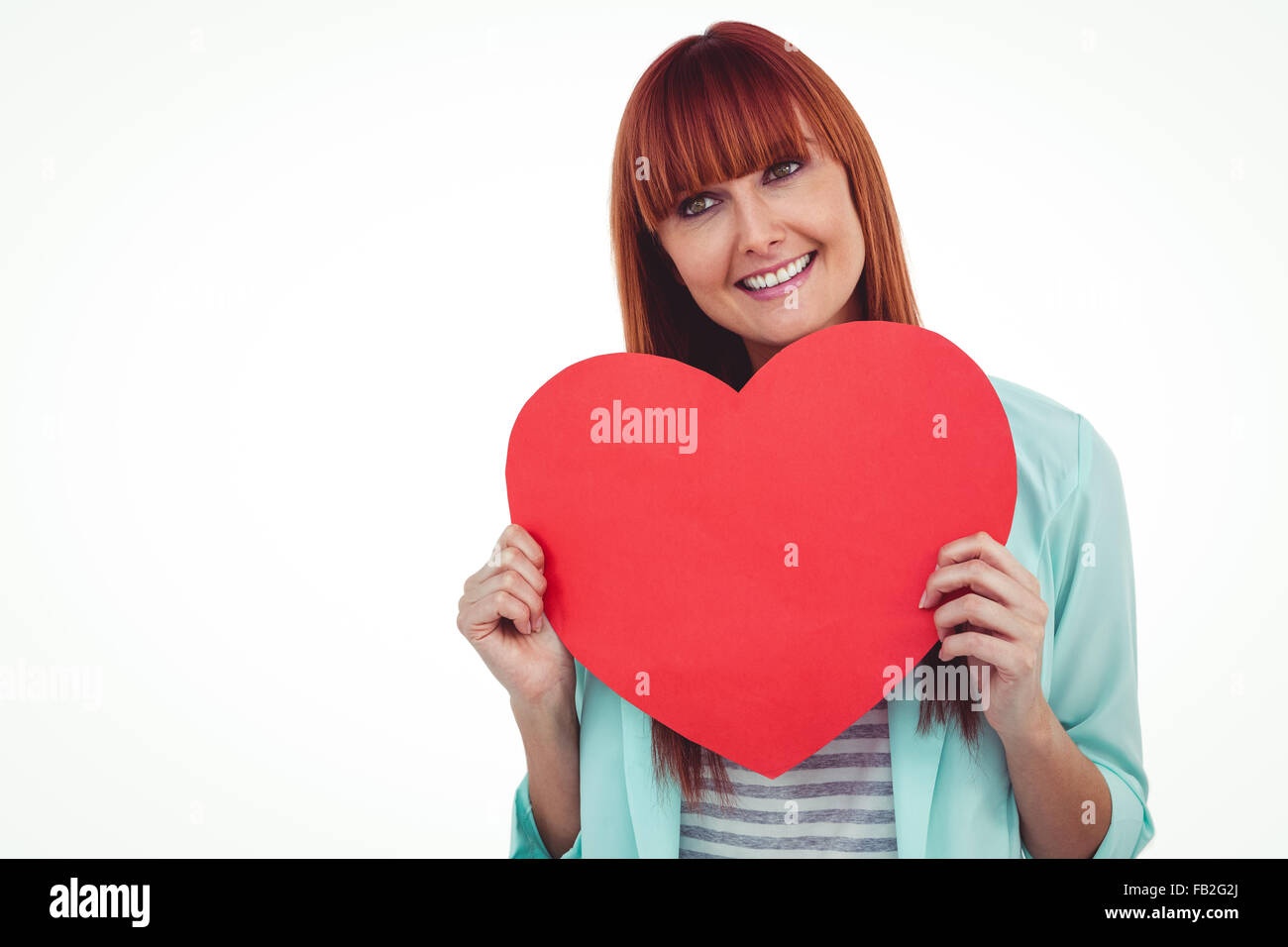 Lächelnde Frau Hipster hinter ein großes rotes Herz Stockfoto
