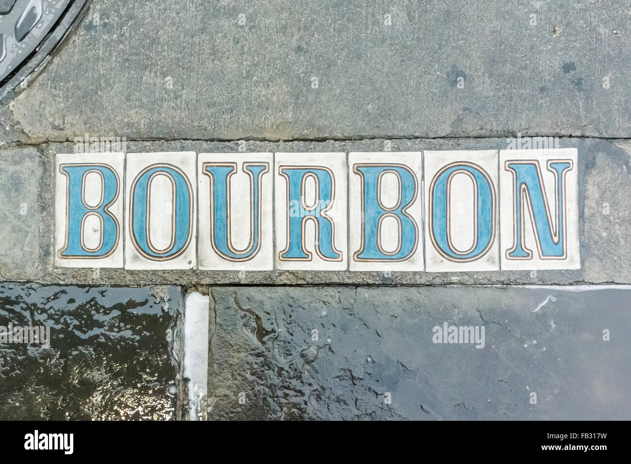 Ein frisch gespült Bürgersteig Zeichen merkt die Ecke Bourbon Street in New Orleans Stockfoto