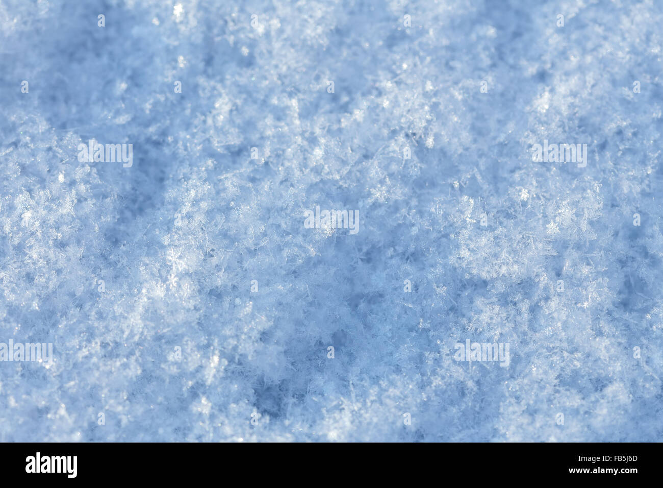 Die Textur der Schneeoberfläche. Stockfoto