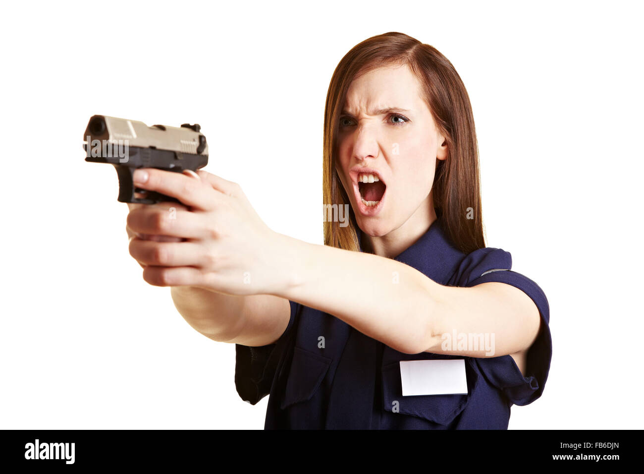 Polizistin schreien eine Warnung vor dem Abfeuern ihrer Waffe Stockfoto