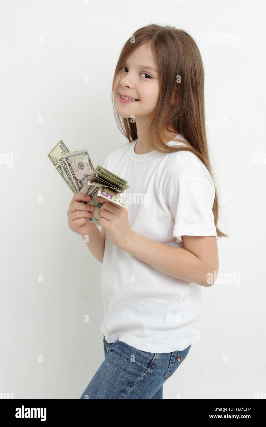 kleine Mädchen und US-Dollar Stockfoto