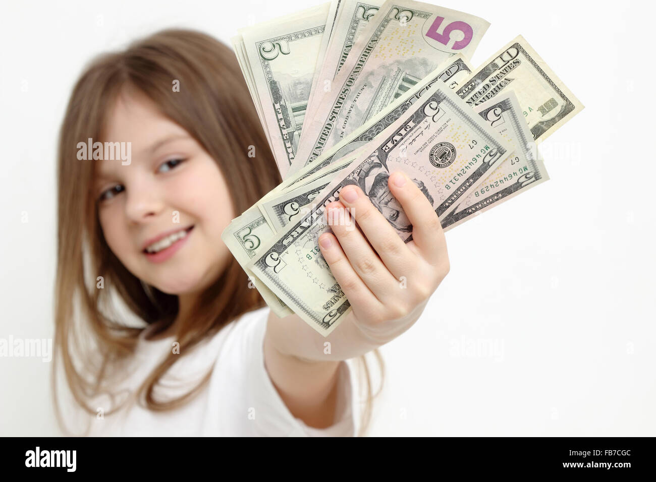 kleine Mädchen und US-Dollar Stockfoto
