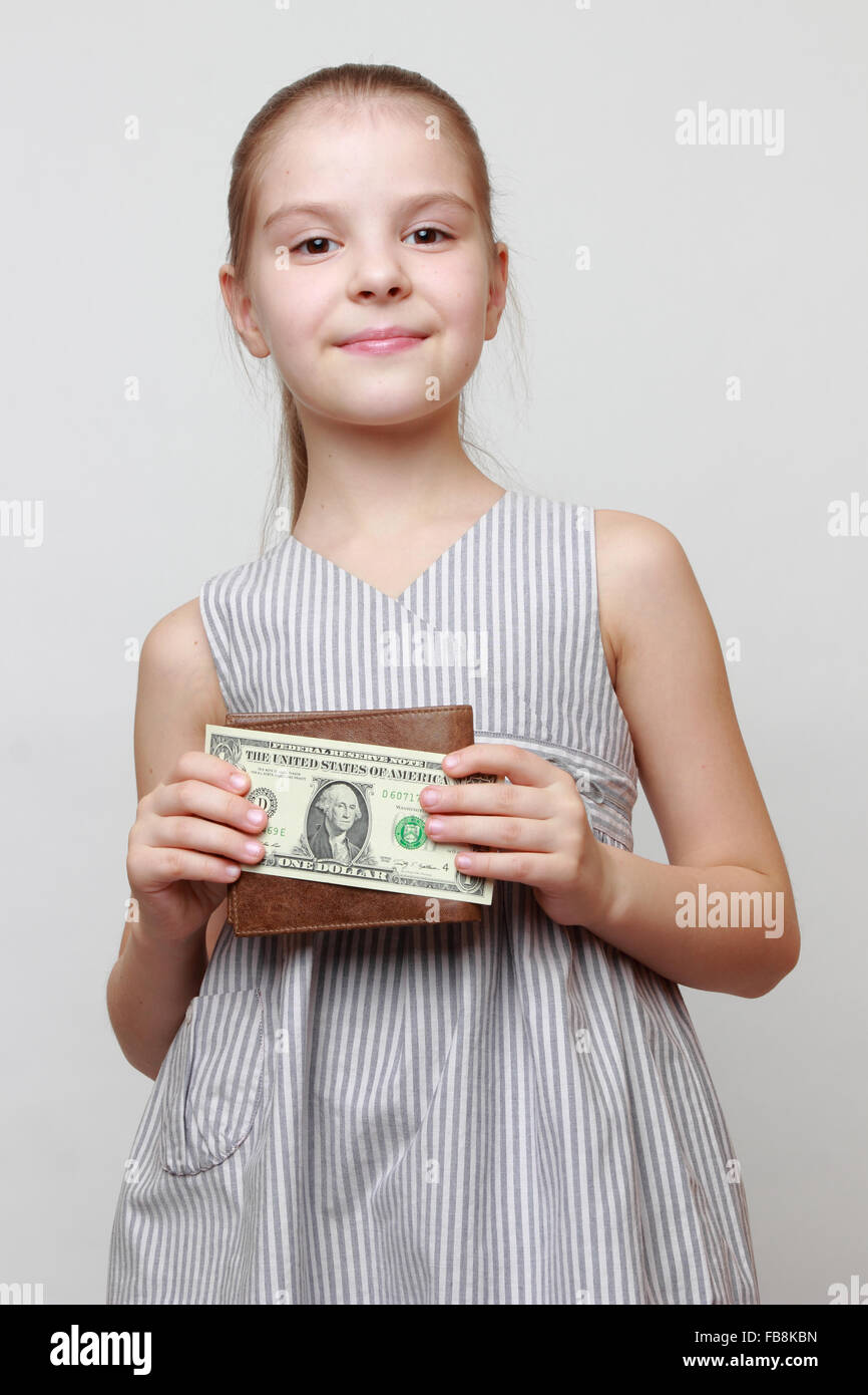 Wunderschönes kleines Mädchen mit Bargeld US-Dollar Stockfoto
