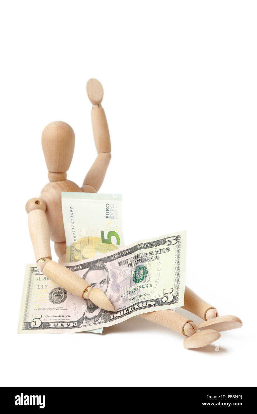 USA-Geld und Euro-Bargeld mit Holzfigur Stockfoto