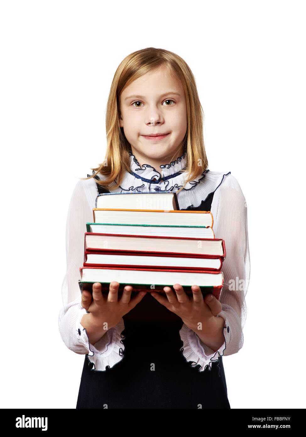 Mädchen Schulmädchen mit einem schweren Stapel Bücher isoliert Stockfoto