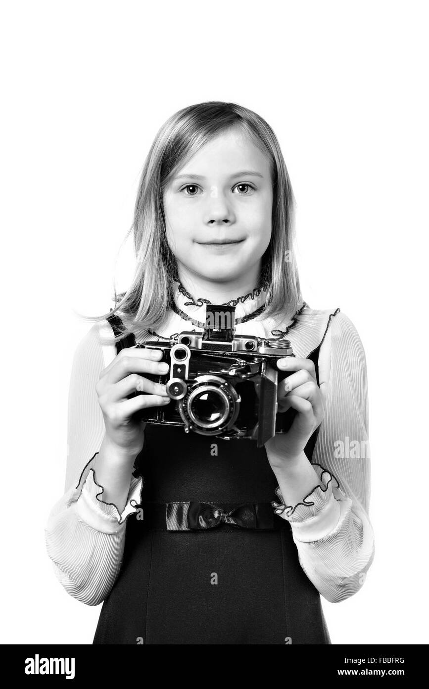 Mädchen-Fotograf mit Retro-Kamera isoliert Stockfoto