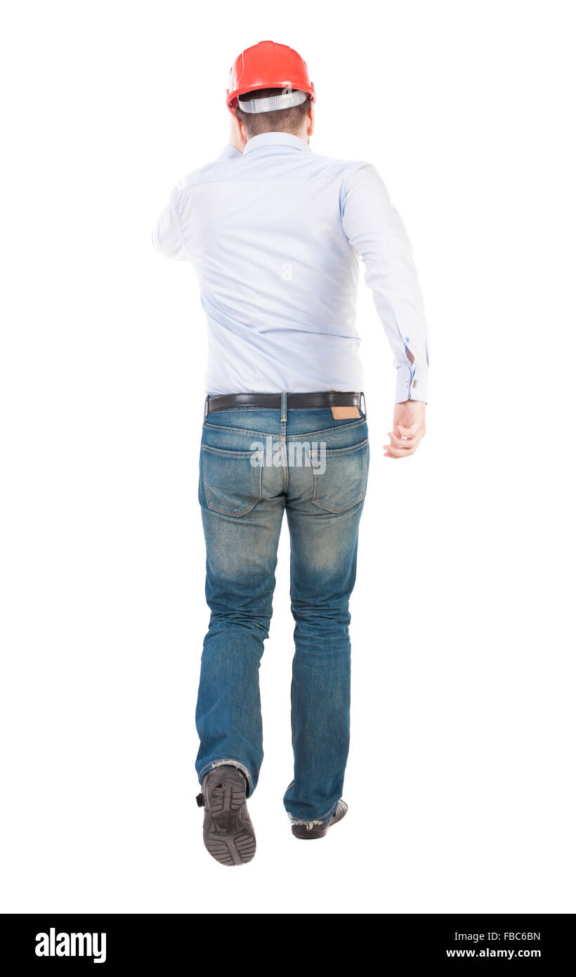 Rückansicht des laufenden Ingenieur im Helm. Zu Fuß Kerl in Bewegung. Hintere Ansicht Menschen Sammlung. Rückseite Blick auf Person. Isolierte o Stockfoto
