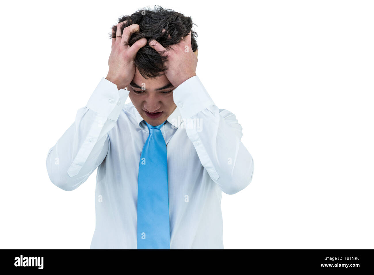 Gereizte asiatischen Geschäftsmann hielt seinen Kopf Stockfoto