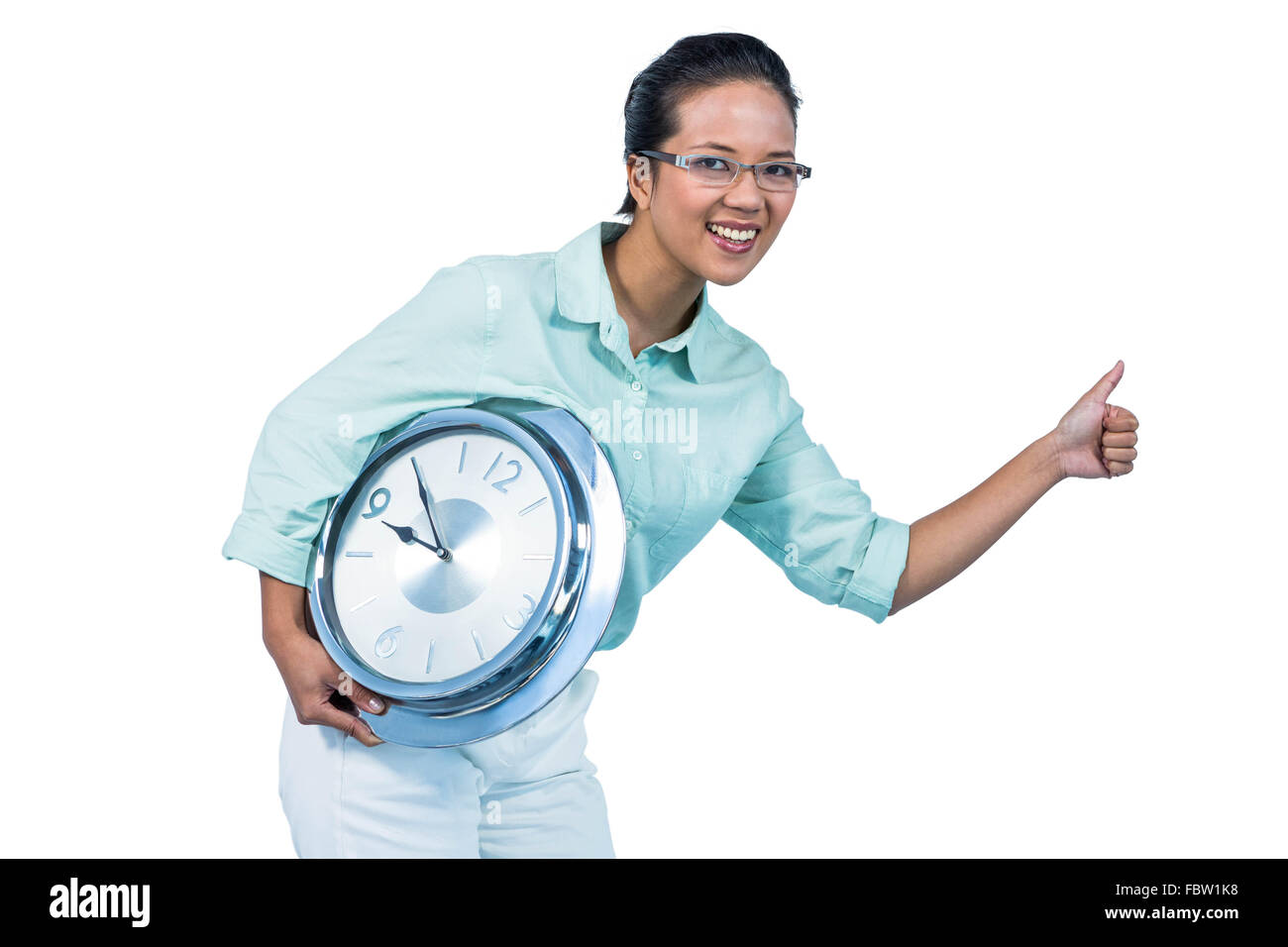 Hocherfreut Geschäftsfrau hält eine Uhr Stockfoto