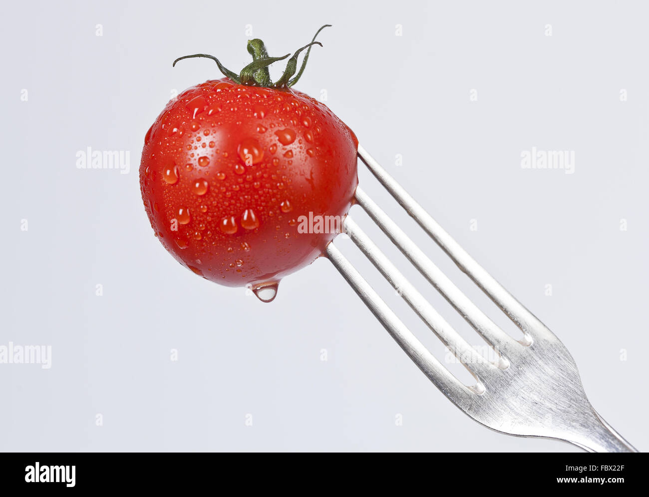 Gabel mit ein wenig Tomate Stockfoto