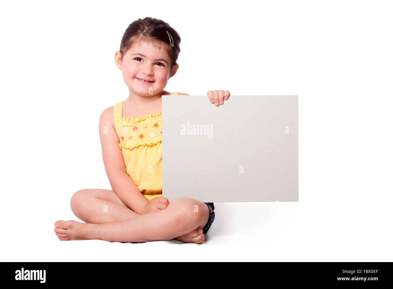 Glückliches Mädchen sitzen mit whiteboard Stockfoto