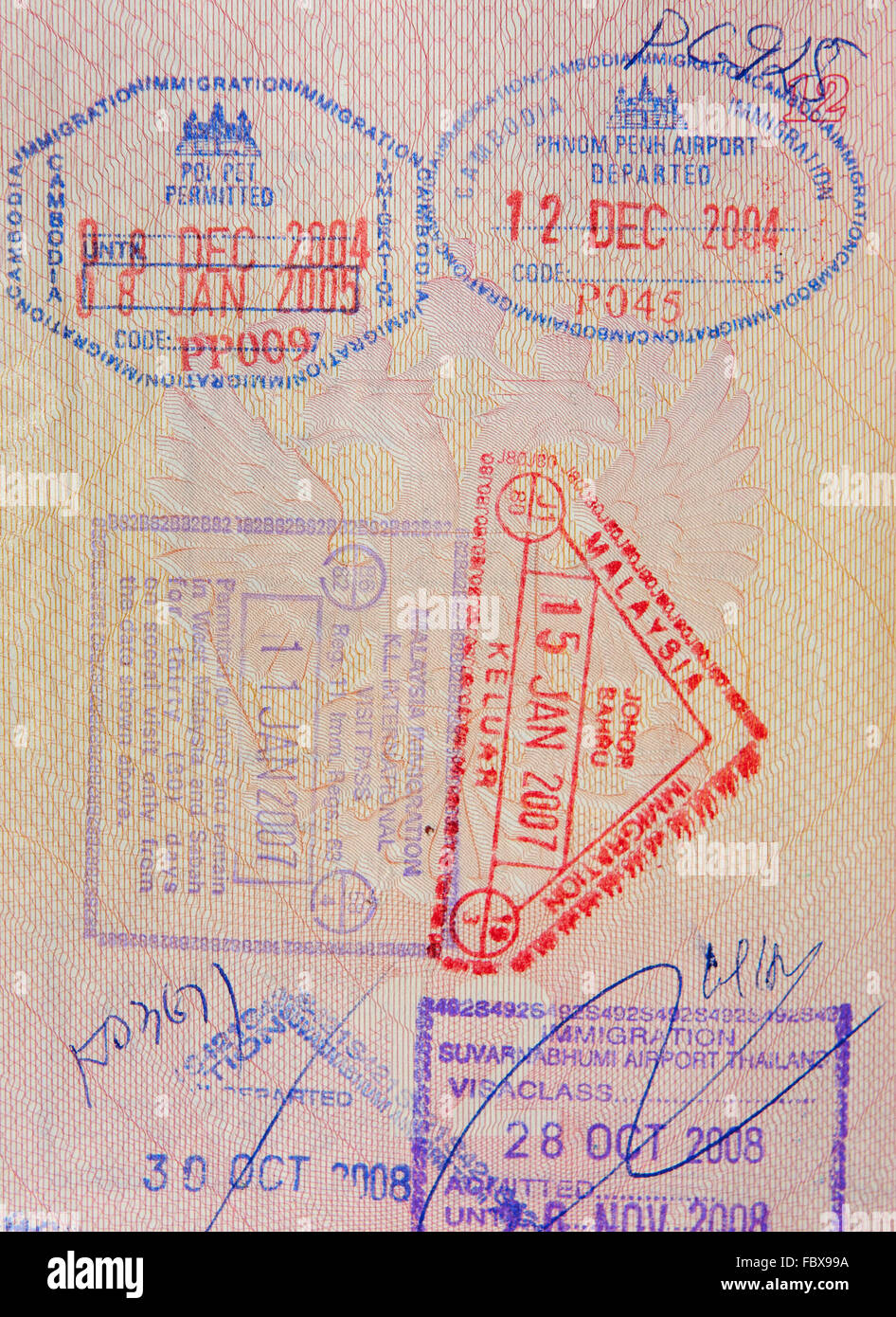 Reisepass mit malaysischen thailändischen und kambodschanischen Briefmarken Stockfoto