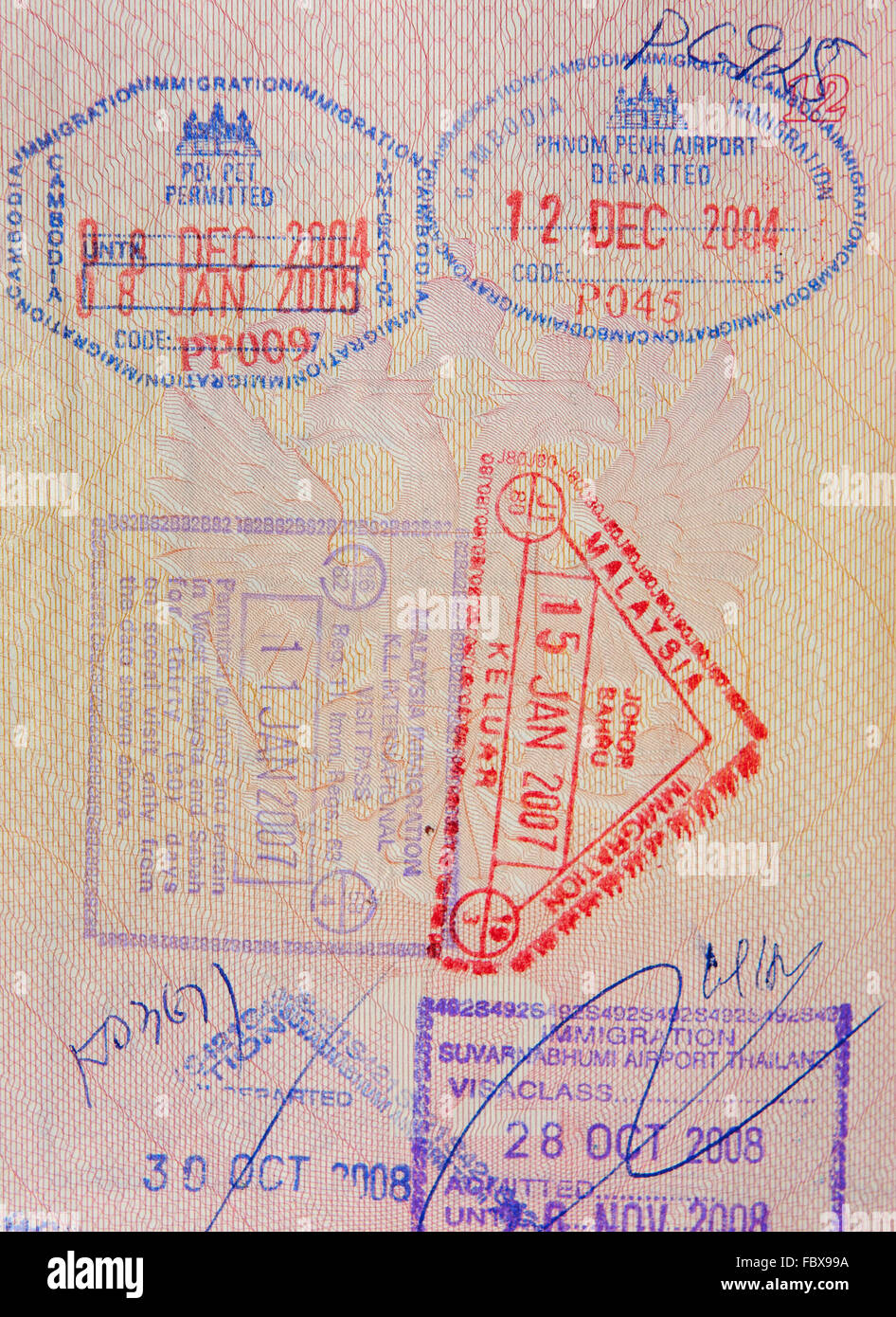 Reisepass mit malaysischen thailändischen und kambodschanischen Briefmarken Stockfoto
