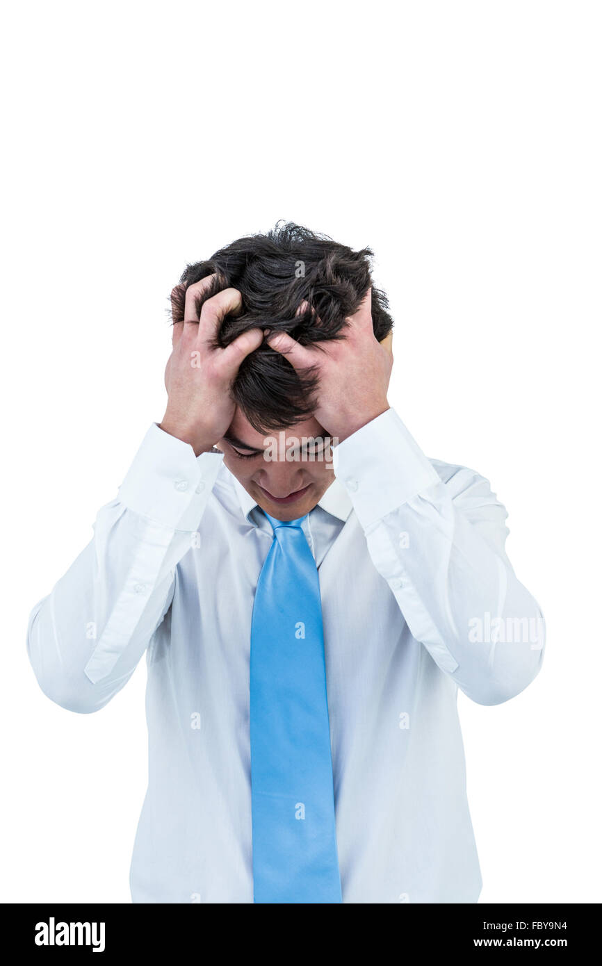 Gereizte asiatischen Geschäftsmann hielt seinen Kopf Stockfoto