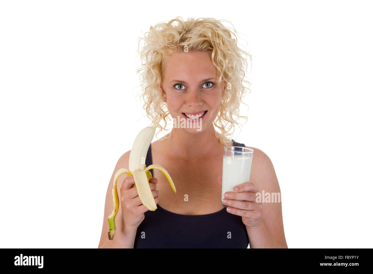 Junge Frau mit Milch und bana Stockfoto