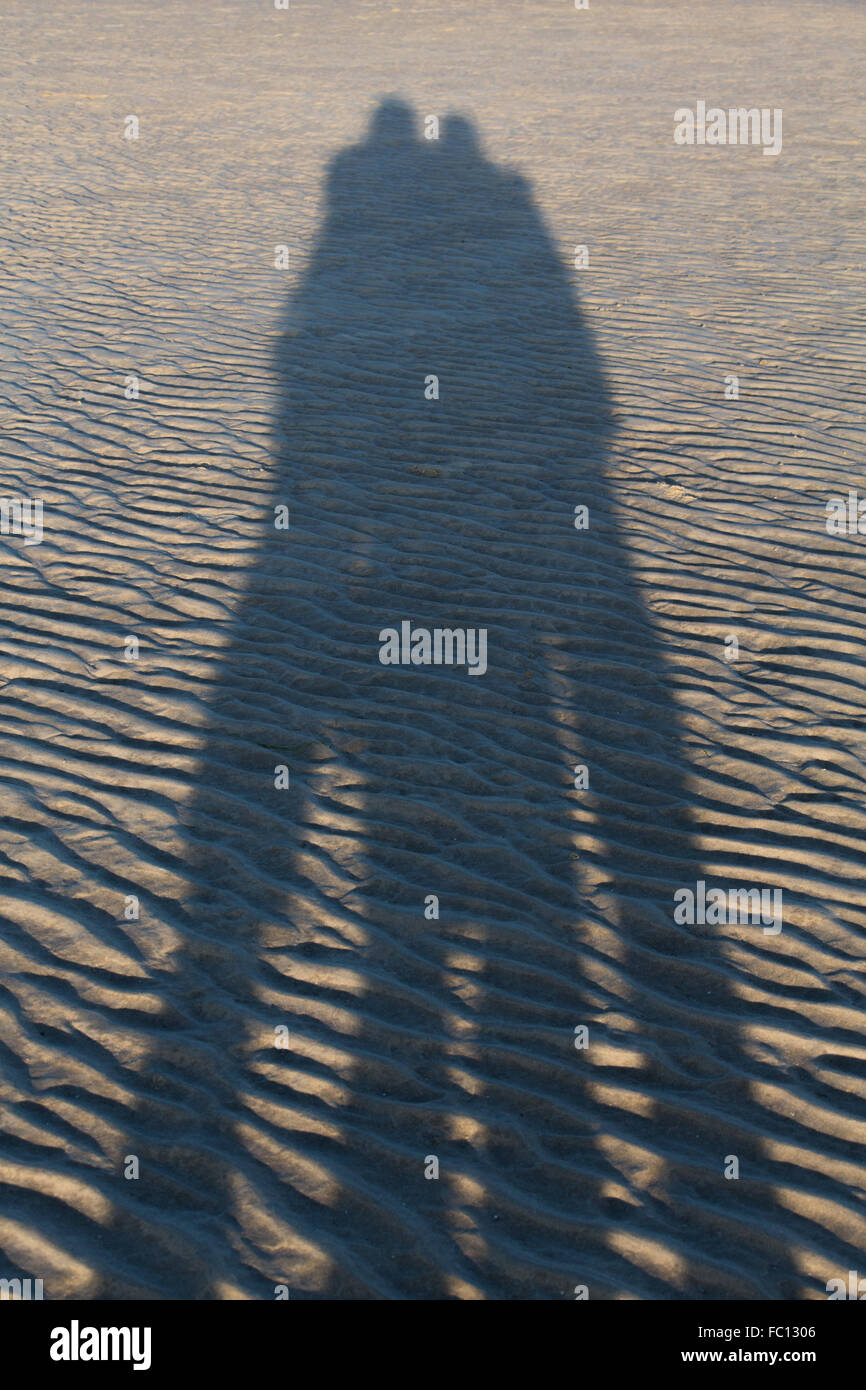 Zwei Schatten im sand Stockfoto