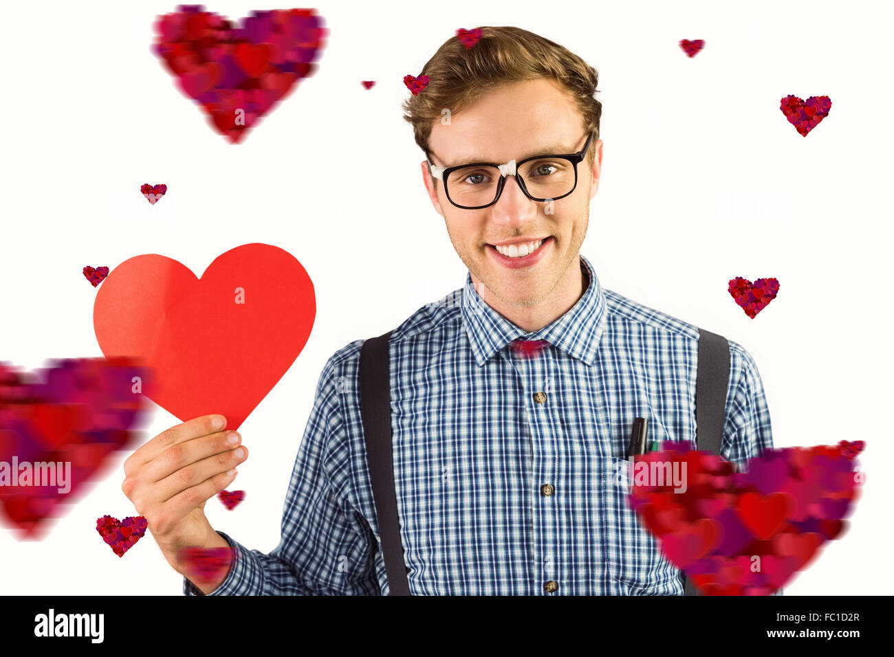 Zusammengesetztes Bild geeky Hipster hielt eine Herzkarte Stockfoto