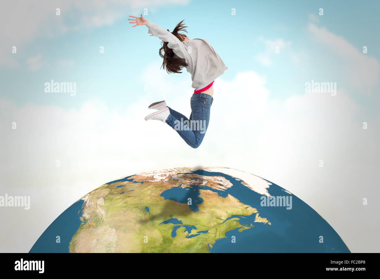 Zusammengesetztes Bild der fröhliche junge Frau springen Stockfoto