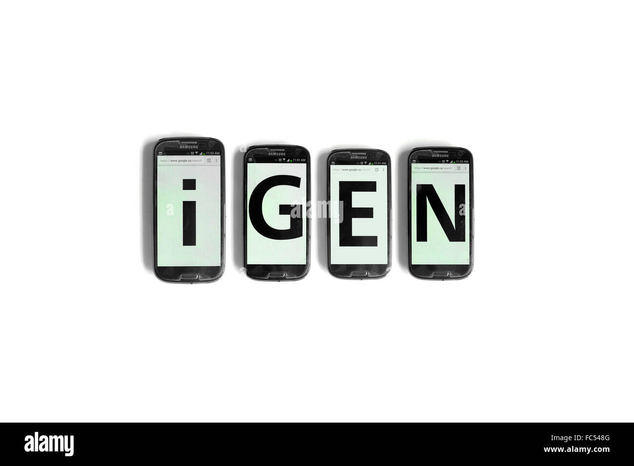 iGen geschrieben auf den Bildschirmen der Smartphones vor weißem Hintergrund fotografiert. Stockfoto