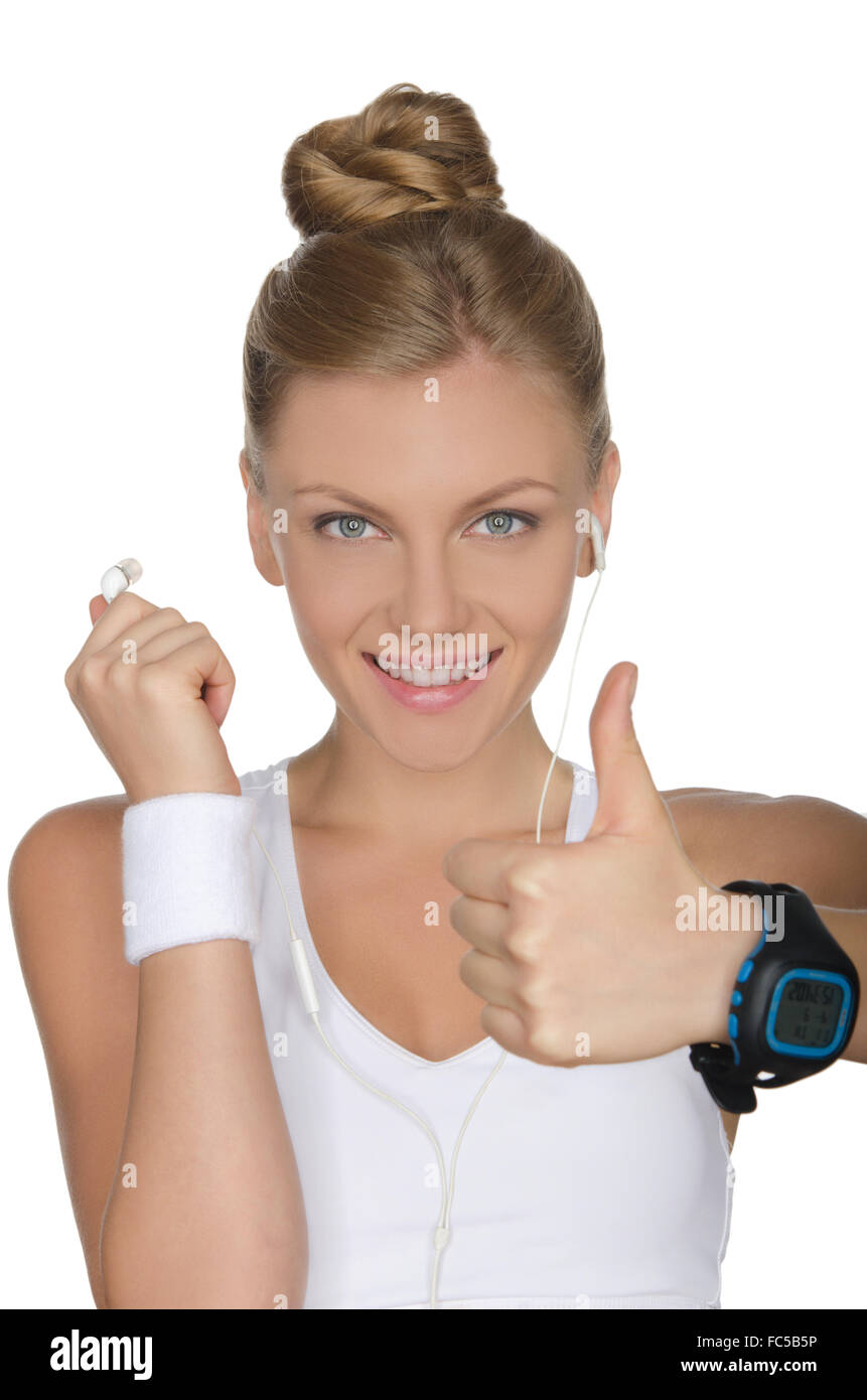 glückliche Frau mit Kopfhörern und Uhr Stockfoto