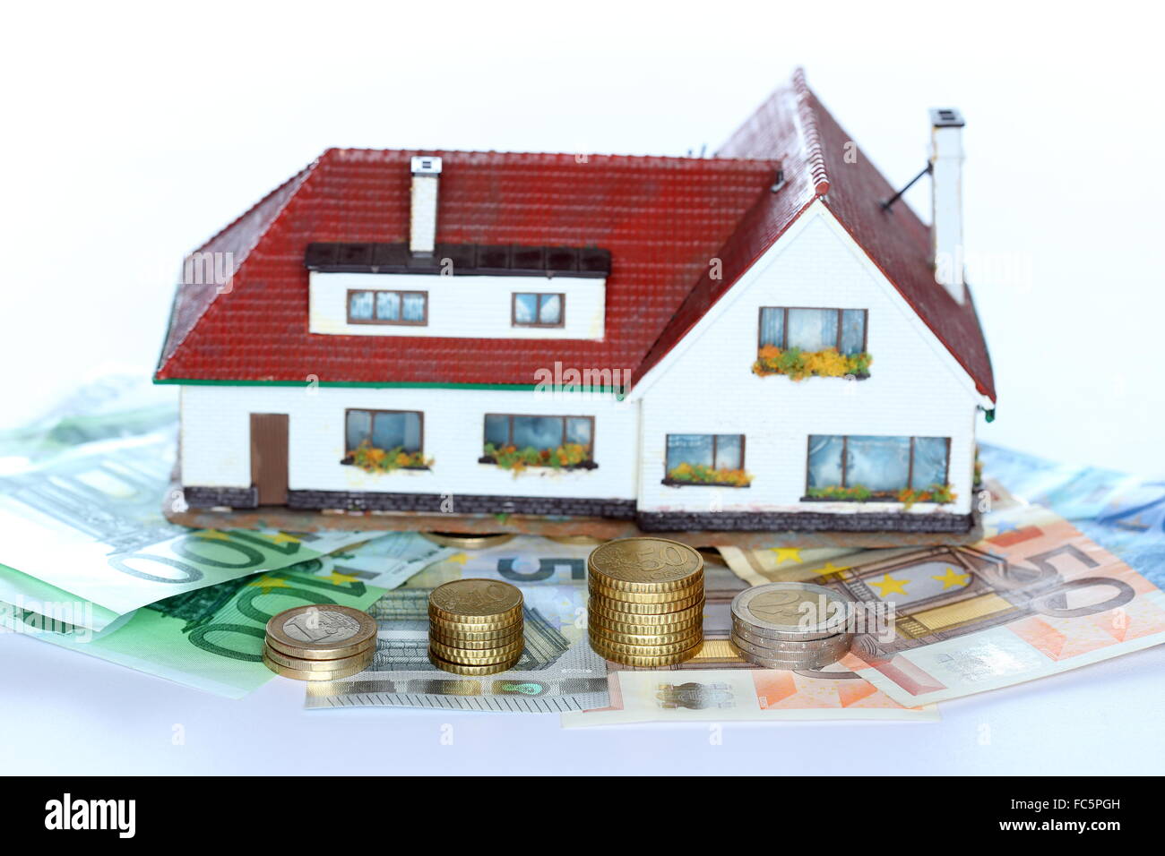 Münze-Stacks und Haus Stockfoto